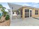 This outdoor patio has a covered pergola offering shade and an extended space for outdoor enjoyment at 583 Arruda Ter, The Villages, FL 32162