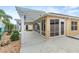 Extended patio with pergola and screened enclosure at 583 Arruda Ter, The Villages, FL 32162