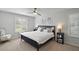 Spacious bedroom with king-size bed and window shutters at 586 Juniper Way, Tavares, FL 32778