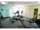 Well-equipped fitness center featuring treadmills, elliptical machines, and weight equipment at 586 Juniper Way, Tavares, FL 32778