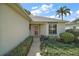 Landscaped front yard with a walkway leading to the house entrance at 586 Juniper Way, Tavares, FL 32778