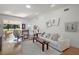 Bright living room with hardwood floors, comfy sofas, and a wood coffee table at 586 Juniper Way, Tavares, FL 32778