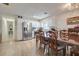 Charming dining area featuring white cabinetry, modern appliances, and stylish flooring at 604 Palmetto Dr, Mascotte, FL 34753