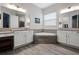 Large bathroom with double sinks, a soaking tub, and a walk-in shower at 729 Calabria Way, Howey In The Hills, FL 34737