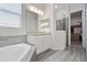 Modern bathroom with double vanity and walk-in shower at 729 Calabria Way, Howey In The Hills, FL 34737