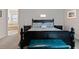 Guest bedroom with a queen bed and a teal bench at 729 Calabria Way, Howey In The Hills, FL 34737