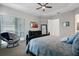 Spacious bedroom with a comfy chair and access to a private balcony at 729 Calabria Way, Howey In The Hills, FL 34737