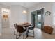 Kitchen dining area with table and chairs, view of pool at 729 Calabria Way, Howey In The Hills, FL 34737