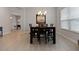 Elegant dining area with a table and six chairs at 729 Calabria Way, Howey In The Hills, FL 34737