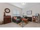 Cozy living room with sectional sofa, game table, and built-in shelving at 729 Calabria Way, Howey In The Hills, FL 34737