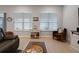 Living room with sectional sofa and wood coffee table at 729 Calabria Way, Howey In The Hills, FL 34737