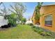 Fenced backyard with lush greenery at 7872 Niagara Falls Ct, Orlando, FL 32825