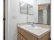 Bathroom with single sink and mirrored medicine cabinet at 7872 Niagara Falls Ct, Orlando, FL 32825