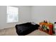 Small bedroom with a double bed and side table at 7872 Niagara Falls Ct, Orlando, FL 32825