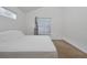 Bright bedroom with a queen bed and window at 7872 Niagara Falls Ct, Orlando, FL 32825