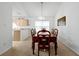 Spacious dining area with a view into the kitchen at 7872 Niagara Falls Ct, Orlando, FL 32825