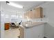 Cozy kitchen with light wood cabinets and a breakfast nook at 7872 Niagara Falls Ct, Orlando, FL 32825