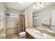 Well-appointed bathroom with shower,grab bars and tiled flooring at 791 Princeton Dr, Clermont, FL 34711