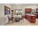 Kitchen with a round dining table and dark wood cabinets at 791 Princeton Dr, Clermont, FL 34711