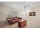 Living room with a brown couch and a wooden coffee table at 791 Princeton Dr, Clermont, FL 34711