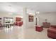 Spacious living room with tile floors, a brown couch, and a wooden coffee table at 791 Princeton Dr, Clermont, FL 34711