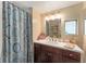 Clean bathroom with a shower, vanity, and window at 807 Maple Ln, The Villages, FL 32159