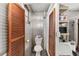 Simple bathroom with toilet and shelving at 807 Maple Ln, The Villages, FL 32159