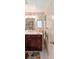 Bathroom with dark wood vanity and shower/tub combo at 807 Maple Ln, The Villages, FL 32159