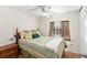 Bedroom with a double bed, ceiling fan, and window at 807 Maple Ln, The Villages, FL 32159