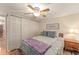 Bedroom with double bed, ceiling fan, and ample closet space at 807 Maple Ln, The Villages, FL 32159