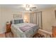 Cozy bedroom with a double bed and ceiling fan at 807 Maple Ln, The Villages, FL 32159