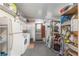 Laundry room with washer, dryer, and storage at 807 Maple Ln, The Villages, FL 32159