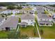 Aerial view of house and surrounding neighborhood at 848 Carmillion Ct, Groveland, FL 34736