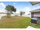 Large backyard with grassy area at 848 Carmillion Ct, Groveland, FL 34736