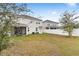 Home's backyard with fenced perimeter at 848 Carmillion Ct, Groveland, FL 34736