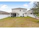 View of home's backyard and screened patio at 848 Carmillion Ct, Groveland, FL 34736