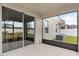 Screened patio with sliding glass doors leading to the backyard at 848 Carmillion Ct, Groveland, FL 34736