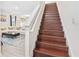 View of living room and staircase with dark wood steps at 848 Carmillion Ct, Groveland, FL 34736