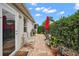 Brick patio with seating area, near sliding glass door and plants at 848 Folsum Pl, The Villages, FL 32162