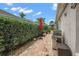 Relaxing brick patio with grill, umbrella, and lush greenery at 848 Folsum Pl, The Villages, FL 32162