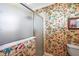 Bathroom with floral wallpaper, shower, and toilet at 848 Folsum Pl, The Villages, FL 32162