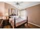 Bedroom with a wooden post bed, ceiling fan and hardwood floor at 848 Folsum Pl, The Villages, FL 32162