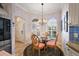 Charming breakfast nook with a round table and built-in seating at 848 Folsum Pl, The Villages, FL 32162