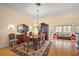 Bright dining room with hardwood floors, chandelier, and seating for six at 848 Folsum Pl, The Villages, FL 32162