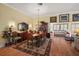 Bright dining room with hardwood floors and access to sunroom at 848 Folsum Pl, The Villages, FL 32162