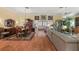 Elegant dining room features a formal table and hardwood floors at 848 Folsum Pl, The Villages, FL 32162