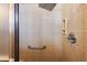 Walk-in shower with grab bar and tiled walls at 848 Folsum Pl, The Villages, FL 32162