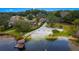 Aerial view of lakefront property with sandy beach at 9605 Hollyglen Pl, Windermere, FL 34786