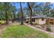 Backyard with pool, screened enclosure and patio at 9605 Hollyglen Pl, Windermere, FL 34786