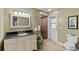 Bathroom with vanity, toilet, and walk-in shower at 9605 Hollyglen Pl, Windermere, FL 34786